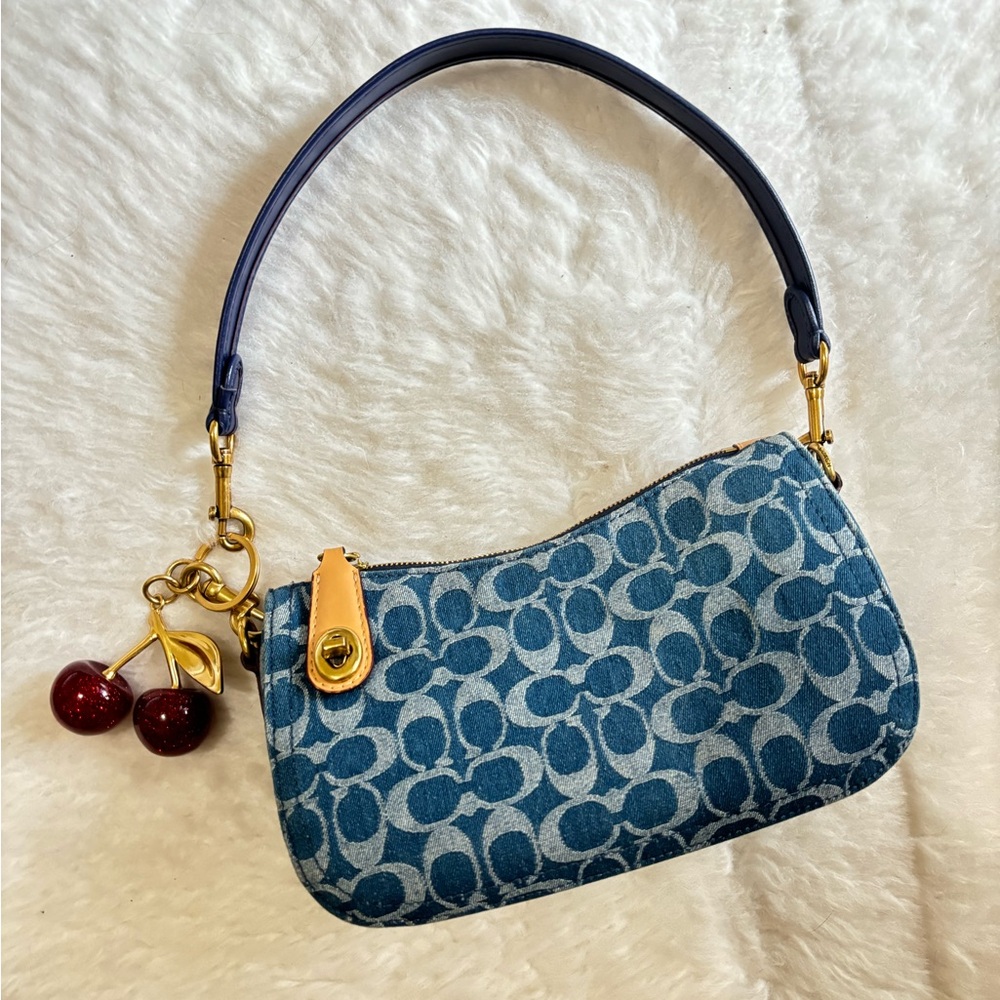 Blue denim cherry charm coach bag